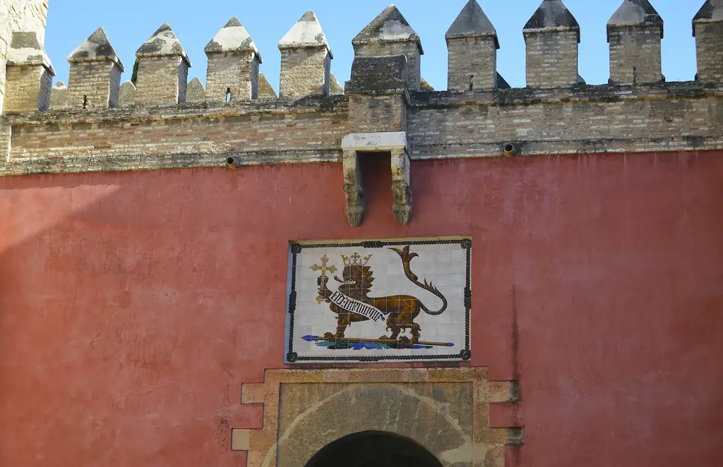 The Lion Gate, the visitors' entrance, with its tiled heraldic lion on a red wall
